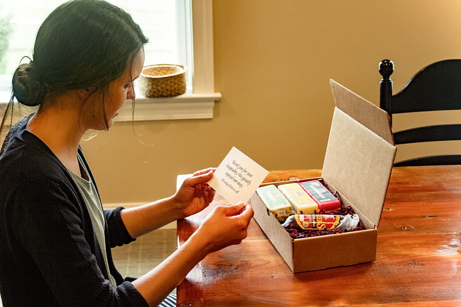 a girl reading a note with cheese